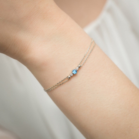 Przejdź do produktu Bransoletka z białego złota 585 z topazem 0,15ct i diamentami The Diamonds B005 